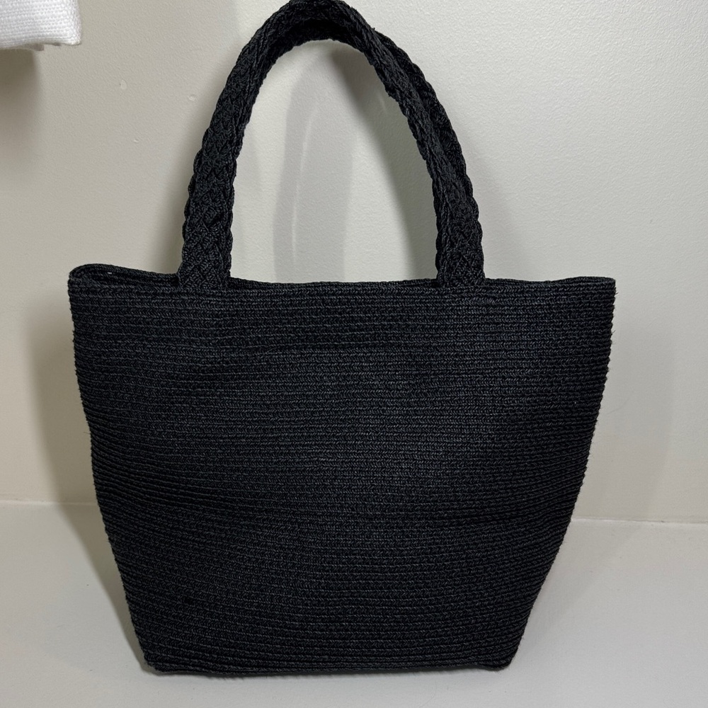 Talbots black cotton/paper blend fabric lined woven handbag.